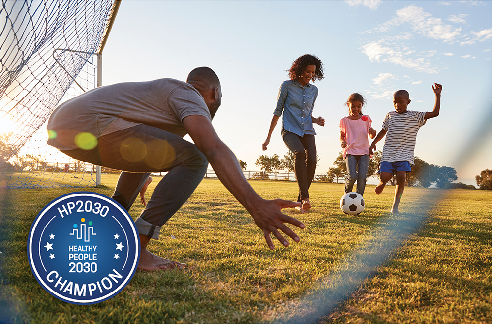 Image of kids play soccer with Healthy People 2030 Champion graphic